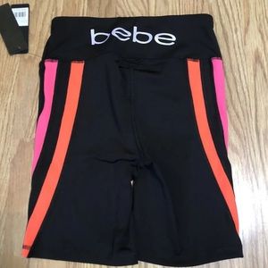 NWT! Bebe Sports Black biker shorts Logo Back Pink orange Stripes